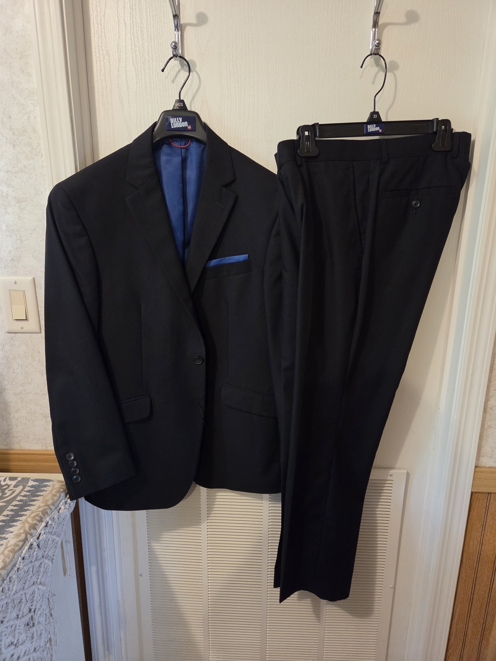 Men's Black Two-Piece Suit with Blue Lining and Pocket Square